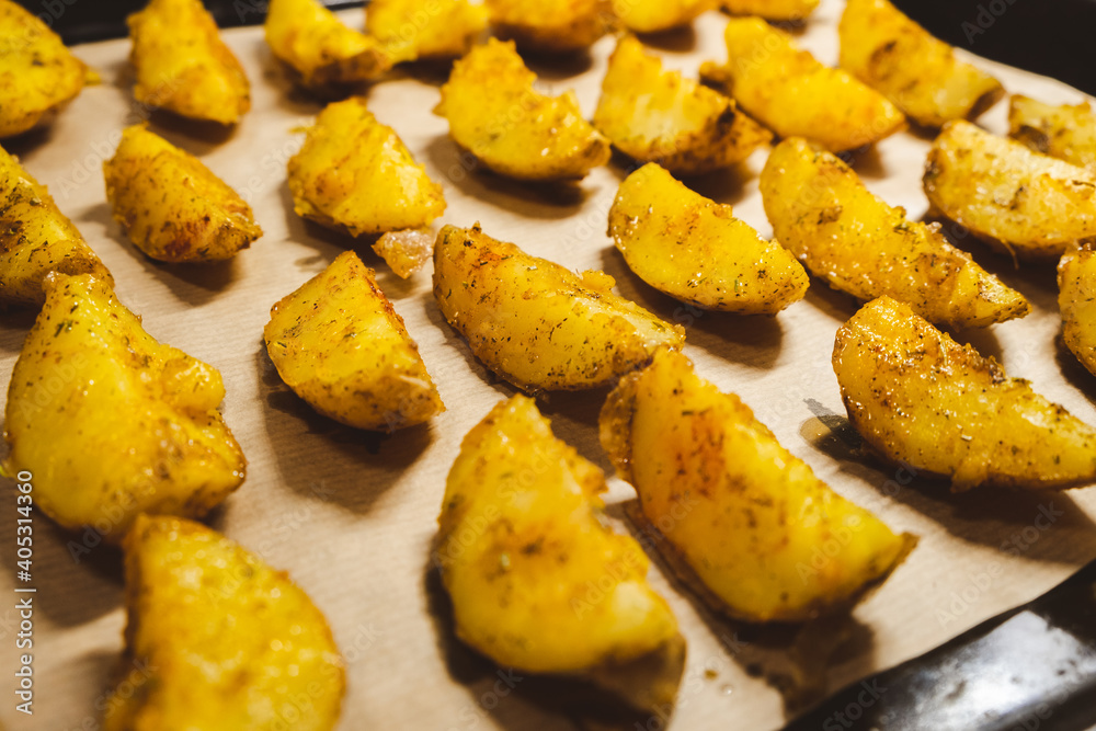 Baked potatoes in the oven close-up Baked potatoes in the oven close-up