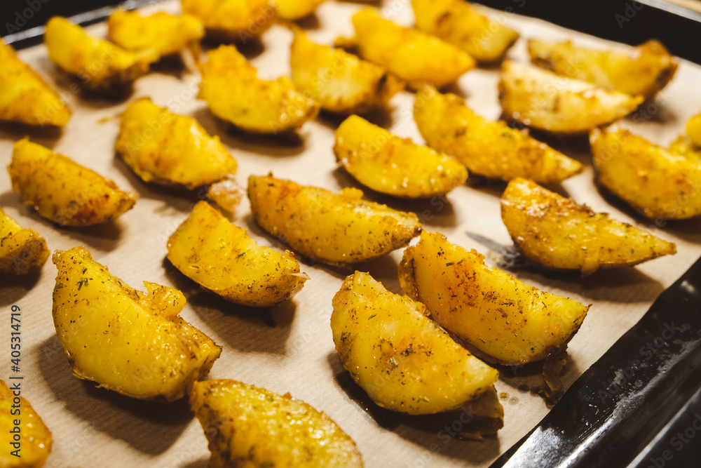 Baked potatoes in the oven close-up Baked potatoes in the oven close-up