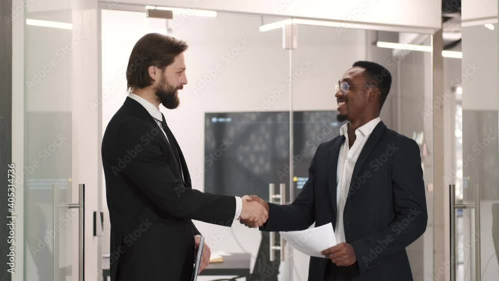 Shot of two businessmen shaking hands. Concept of partnership.