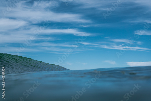 Breaking Waves and spray  white water and light reflected on the surface of the water