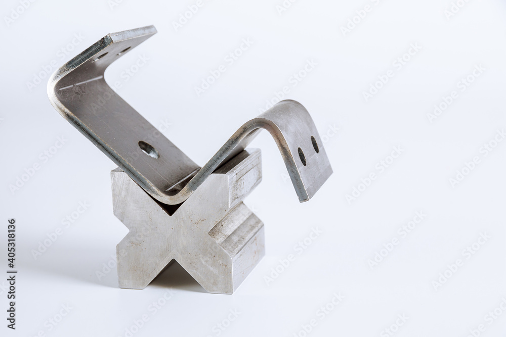 Sheet metal bending tool and equipment isolated on a white background. Bend tools, press brake punch and die. Sheet metal bending tool and equipment isolated on a white background. Bend tools, press brake punch and die.