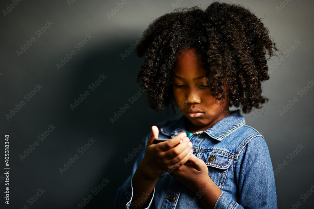 Girl with afro using cell phone Girl with afro using cell phone
