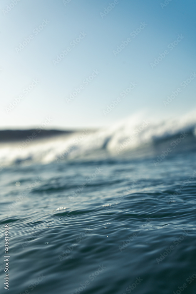 Breaking Waves and spray, white water and light reflected on the surface of the water Breaking Waves and spray, white water and light reflected on the surface of the water