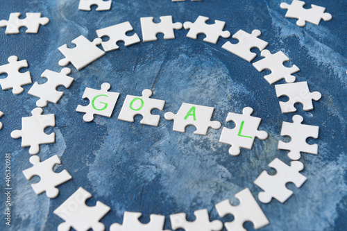 Puzzle pieces with word GOA...
