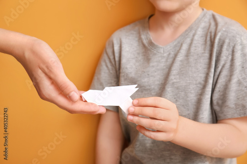 Hands of family with paper ...