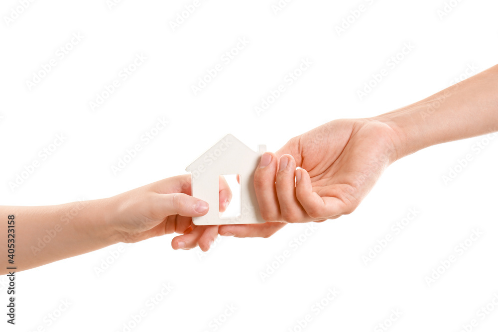 Hands of family with figure of house isolated on white background Hands of family with figure of house isolated on white background