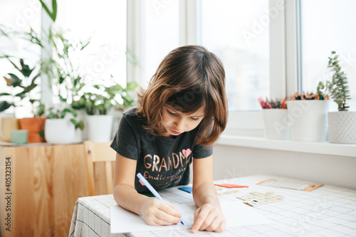 Cute five years girl learning home. photo