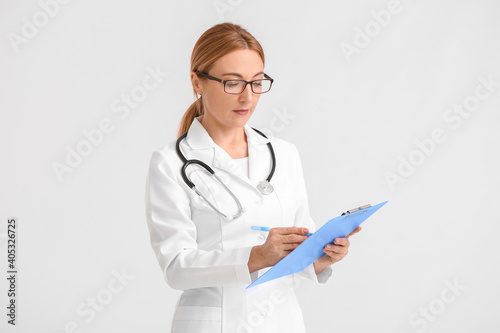 Female doctor in white lab ...