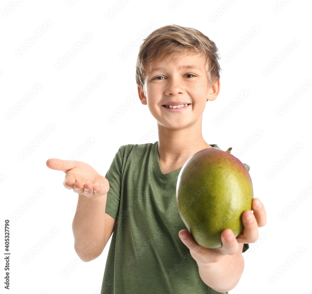 Cute little boy with fresh tasty mango on white background Cute little boy with fresh tasty mango on white background