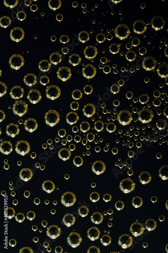 Golden air bubbles on a flat surface