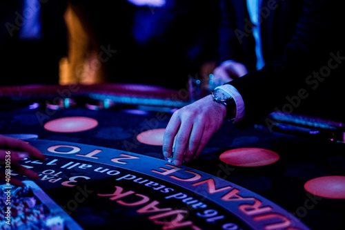 Fotografie, Obraz Cropped Hands Of People Gambling In Casino