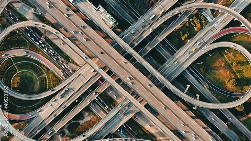 Aerial view of the cars driving on multi-level highway in Bangkok city,  direct above to the road traffic in a big city in rush hour