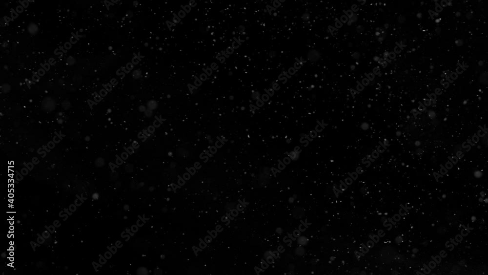 Super slow motion of natural snow falling on black background. Filmed on high speed cinema camera, 1000fps. Super slow motion of natural snow falling on black background. Filmed on high speed cinema camera, 1000fps.