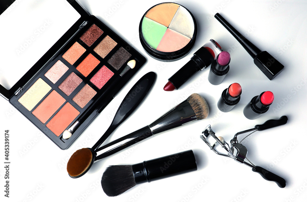 Colorful makeup cosmetics. Top view on white background. Colorful makeup cosmetics. Top view on white background.