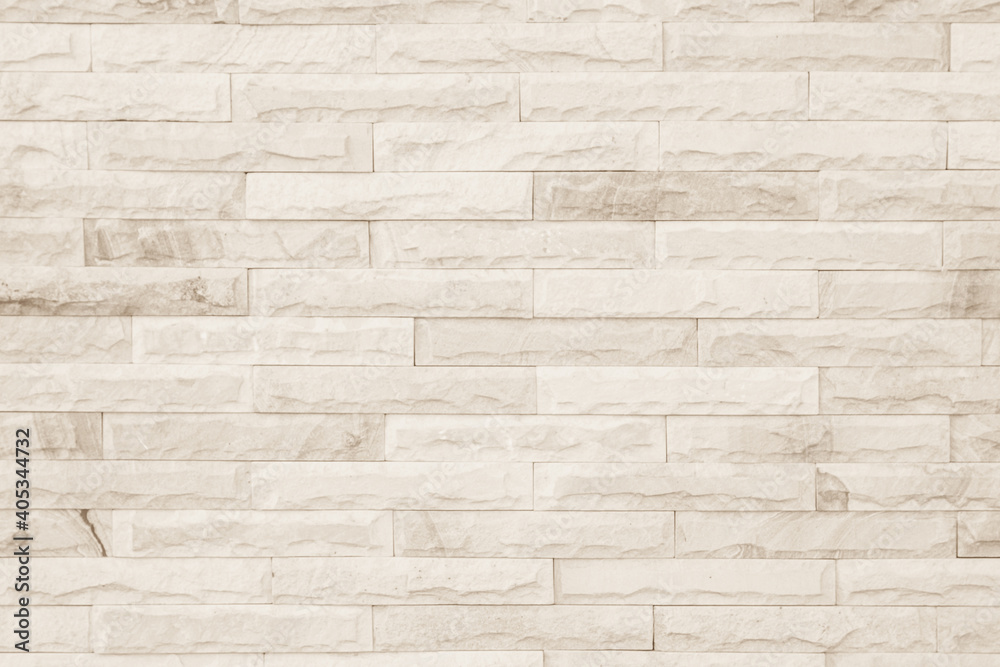 Empty background of wide cream brick wall texture. Beige old brown brick wall concrete or stone textured, wallpaper limestone abstract flooring/Grid uneven interior rock. Home decor design backdrop.