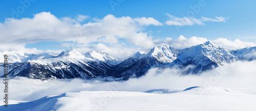 Panoramic view of mountains near Brianson, Serre Chevalier resort, France. Ski resort landscape on clear sunny day. Mountain ski resort. Snow slope. Snowy mountains. Winter vacation. Panorama, banner. © photo-lime