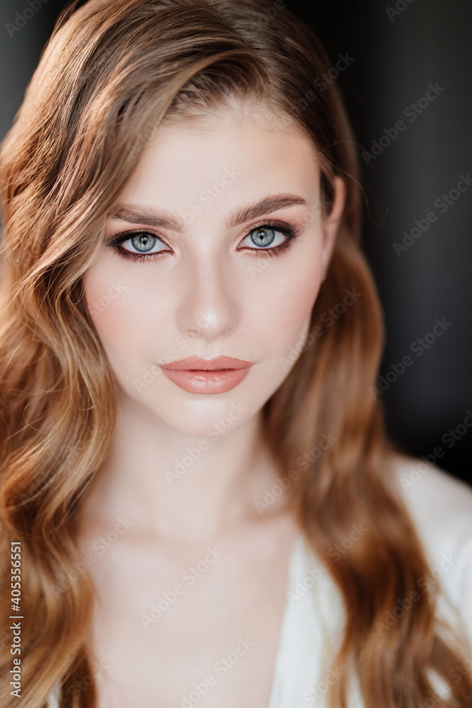 beautiful woman with long hair and makeup. make-up and styling for a wedding beautiful woman with long hair and makeup. make-up and styling for a wedding