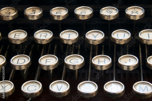 Keyboard of old portable typewriter, writing technology in office, journalism or studies.