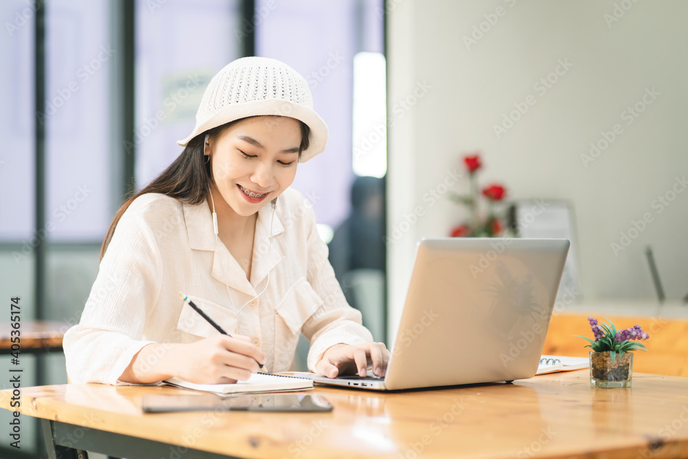 Young business woman working on computor at her home. Work from home concept. Young business woman working on computor at her home. Work from home concept.