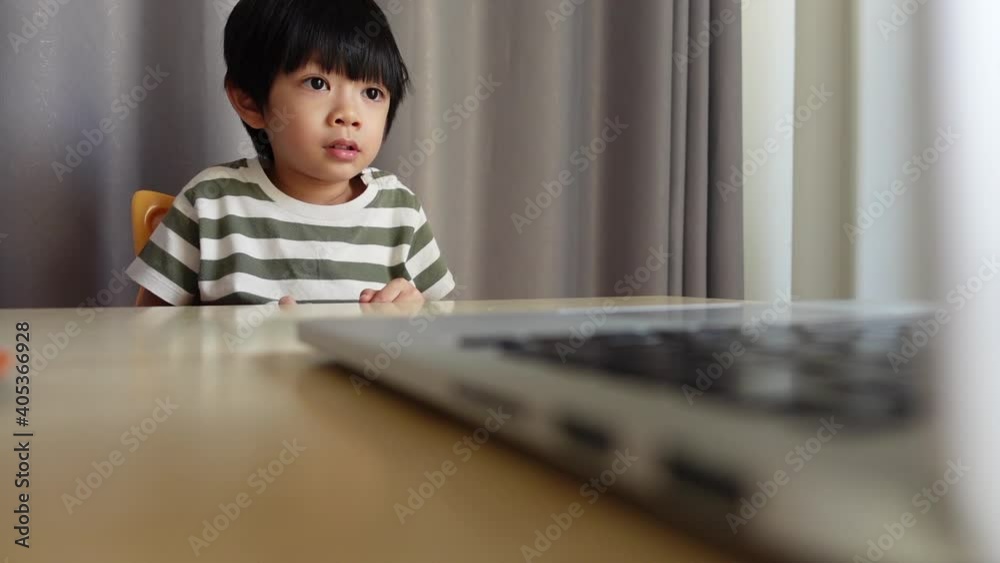 kid study education learning online from home with video conference meeting technology, lifestyle new normal concept of coronavirus pandemic kid study education learning online from home with video conference meeting technology, lifestyle new normal concept of coronavirus pandemic