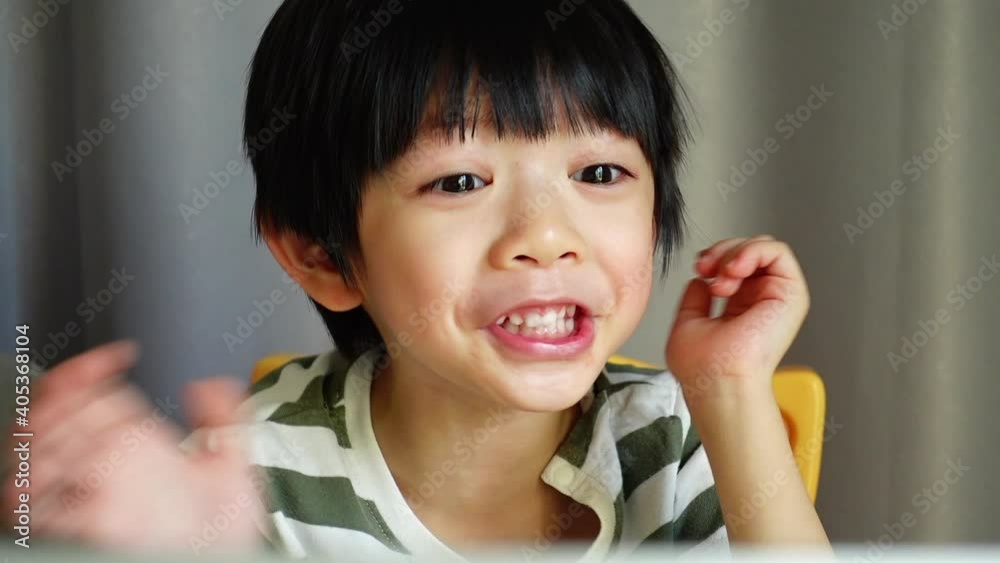 kid study education learning online from home with video conference meeting technology, lifestyle new normal concept of coronavirus pandemic kid study education learning online from home with video conference meeting technology, lifestyle new normal concept of coronavirus pandemic