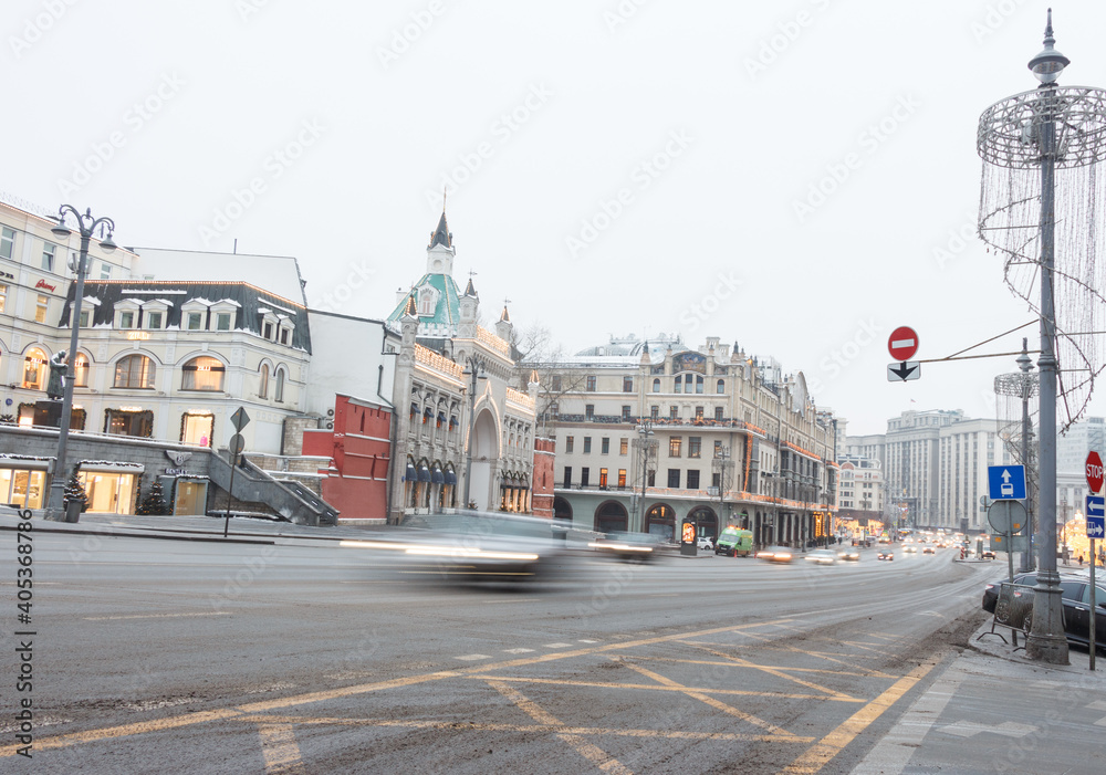 Moscow, Russia, Dec 31, 2020: Teatralny passage. Parliament house in background. Cars rushing