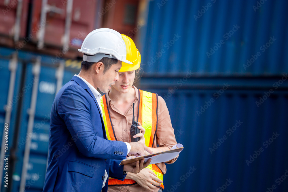 Engineer and worker team checking containers box from cargo, Logistic and teamwork concept Engineer and worker team checking containers box from cargo, Logistic and teamwork concept