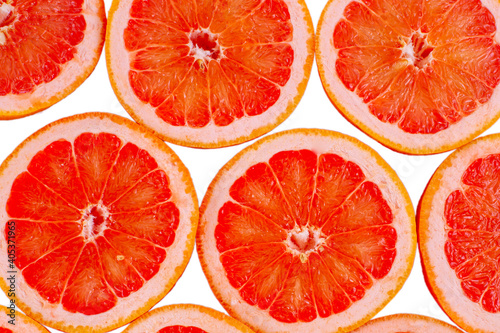 Sliced fresh  juisy vitaminous bright red  grapefruit background photo