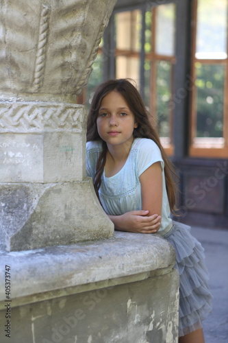 A girl at the station of the Psyrzkha (Psyrtskha) railway. New Athos photo