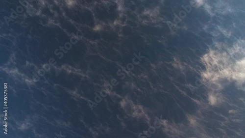 View of the moving fog over the lake from a height at dawn
