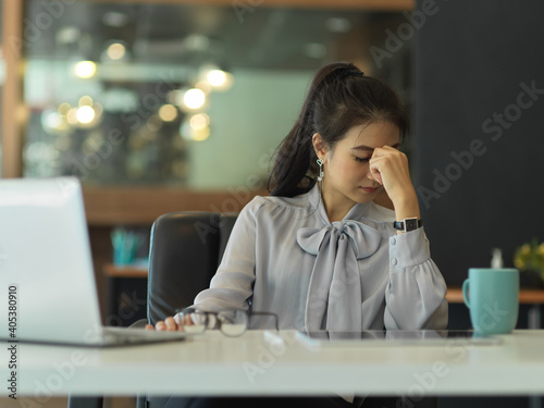 Businesswoman felling upset while working in her office room