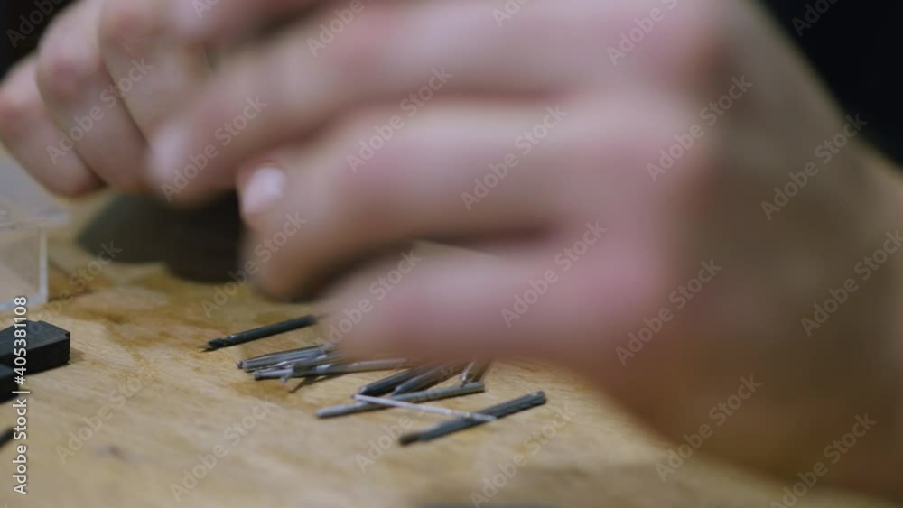 Wood carver chooses drill bits for wood processing machine. The sounds of hand instruments Wood carver chooses drill bits for wood processing machine. The sounds of hand instruments