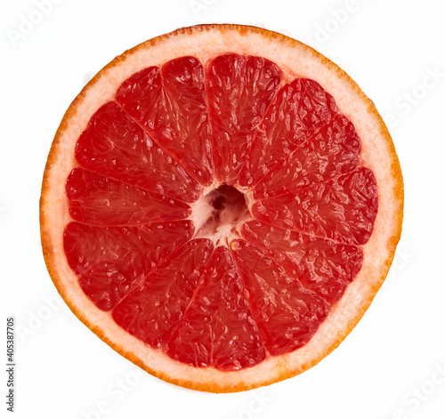 red grapefruit lies on a red background