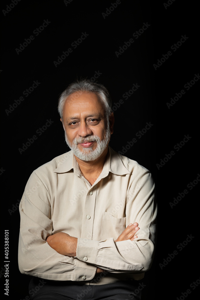 PORTRAIT OF A CONFIDENT OLD MAN LOOKING AT CAMERA AND SMILING PORTRAIT OF A CONFIDENT OLD MAN LOOKING AT CAMERA AND SMILING