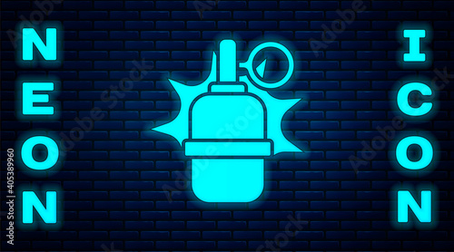 Glowing neon Hand grenade icon isolated on brick wall background. Bomb explosion. Vector.