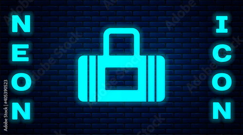 Glowing neon Sport bag icon isolated on brick wall background. Vector.
