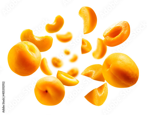 Apricots levitate on a white background. Ripe fruit in flight