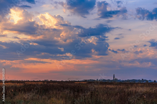 landscape with the Orthodox Church on the horizon in the autumn evening
