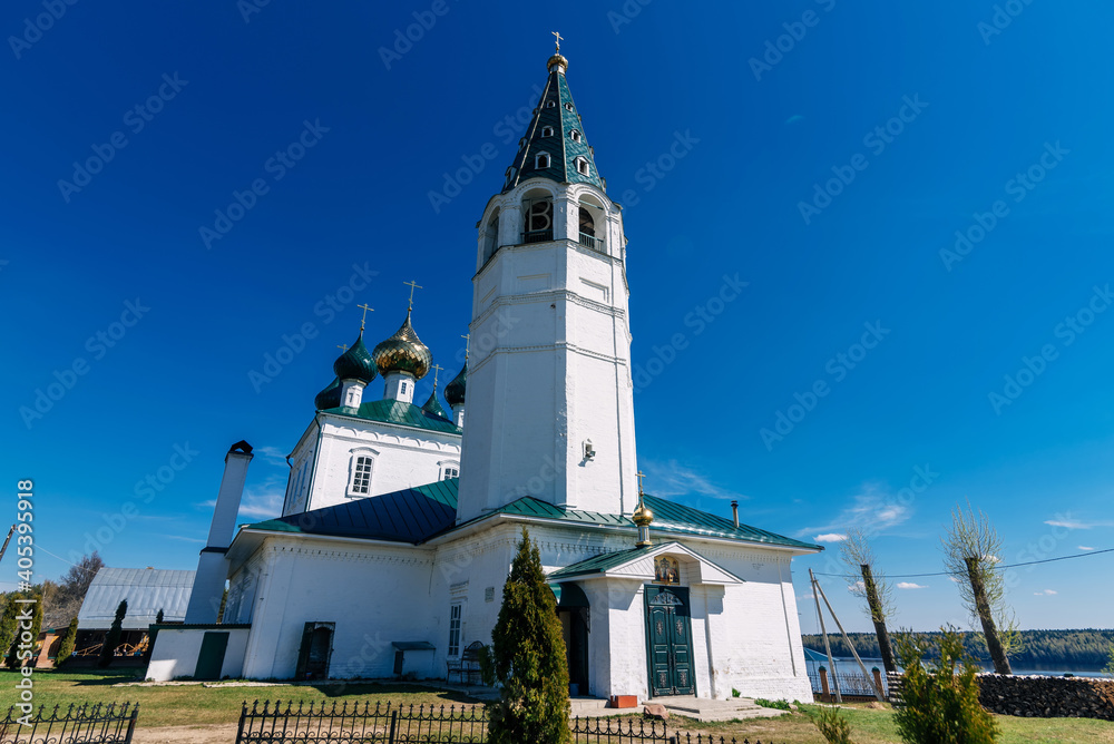 Obraz premium Ancient Orthodox Christian white stone Church in Russia on the banks of the Volga river