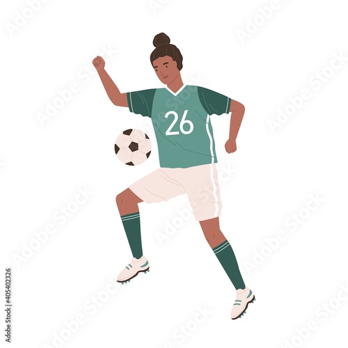 Young female soccer player kicking ball. African American woman playing footb...