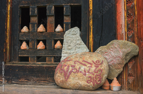Votive offerings in ancient Wanduechhoeling or Wangdicholing palace in Jakar, Bumthang, central Bhutan  photo