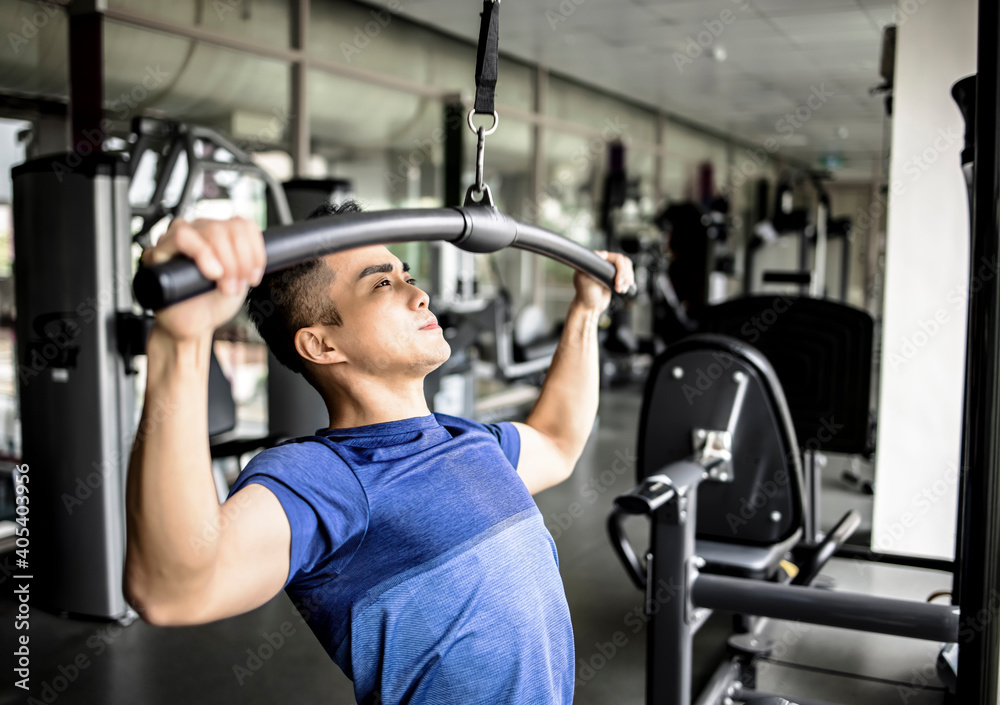 Active young man working exercise in the gym Active young man working exercise in the gym