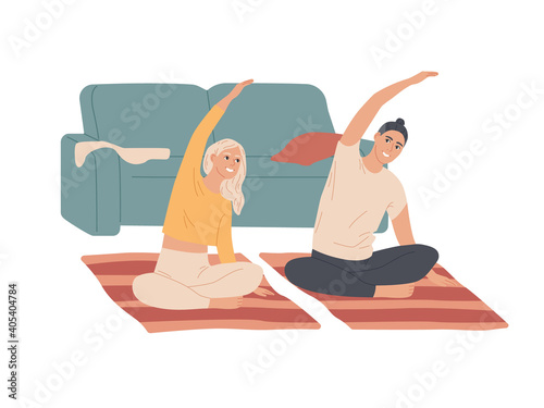 Couple of young people do exercises at home
