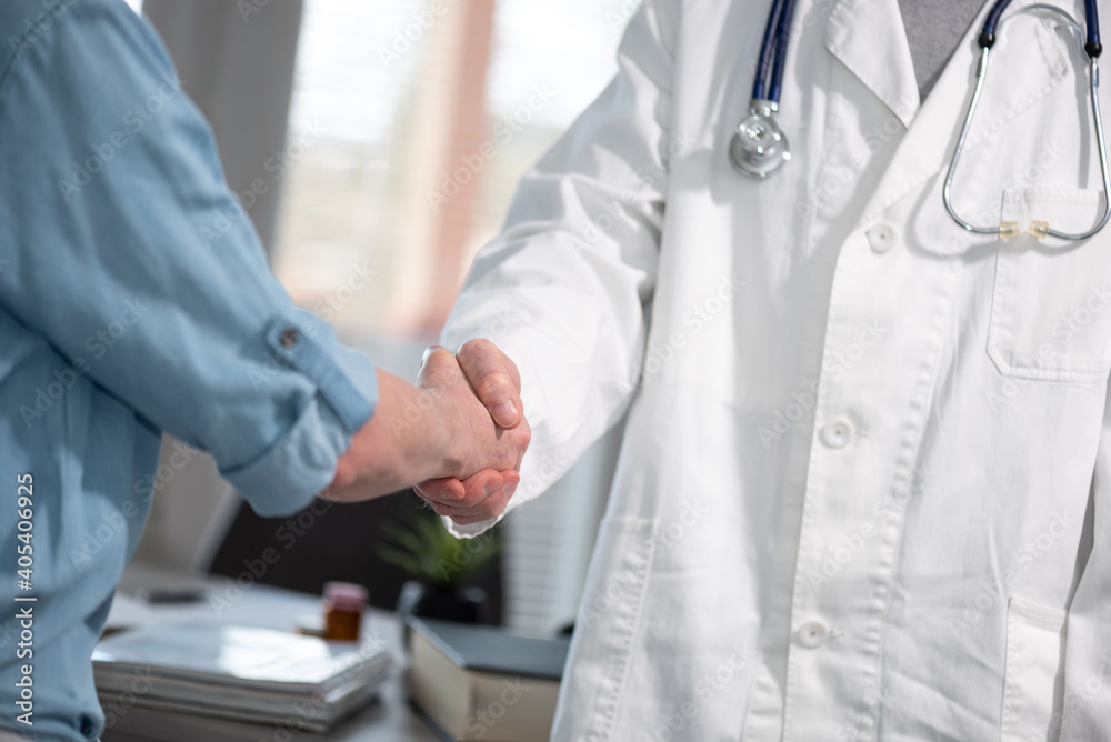 Handshake between doctor and patient Handshake between doctor and patient