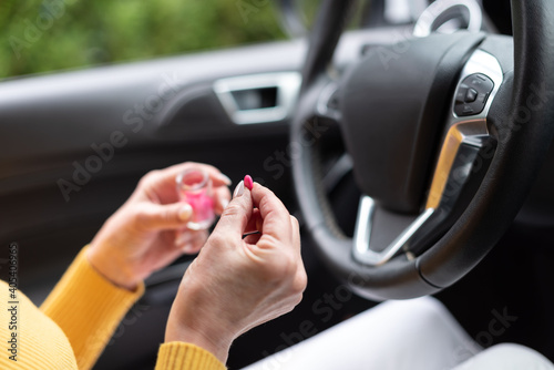 Woman taking pills before driving