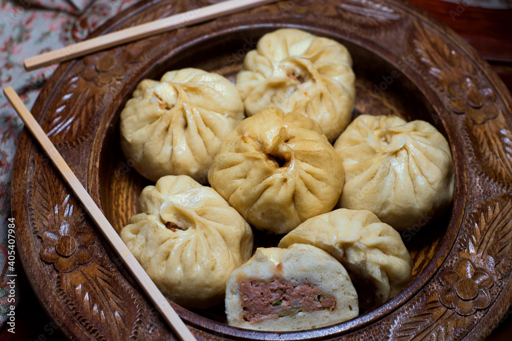 Freshly made Bao Zi steamed stuffed Chinese buns with chicken and shiitake, pork and spring onion, vegetables and egg Freshly made Bao Zi steamed stuffed Chinese buns with chicken and shiitake, pork and spring onion, vegetables and egg