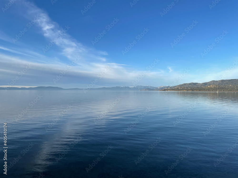 Landscape  view of clouds reflected in the calm blue waters of Lake Tahoe