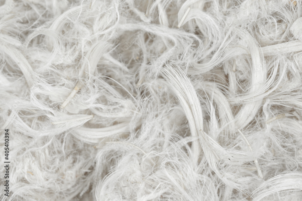 Obraz premium White feathers and fluff from pillows texture background