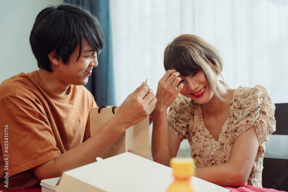 Man surprise woman by propose for marriage in dinning room. Man surprise woman by propose for marriage in dinning room.
