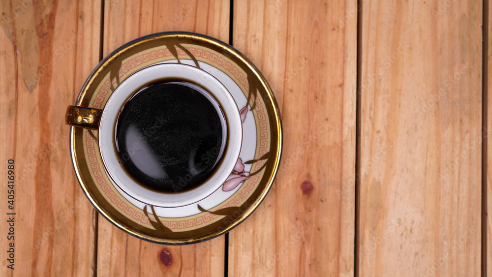 black coffee at cup on top wood table